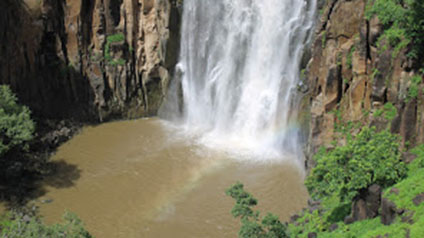 9 seater tempo traveller hire in Patalpani Waterfall